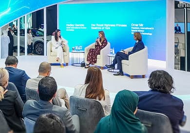 Panel discussion on stage with speakers